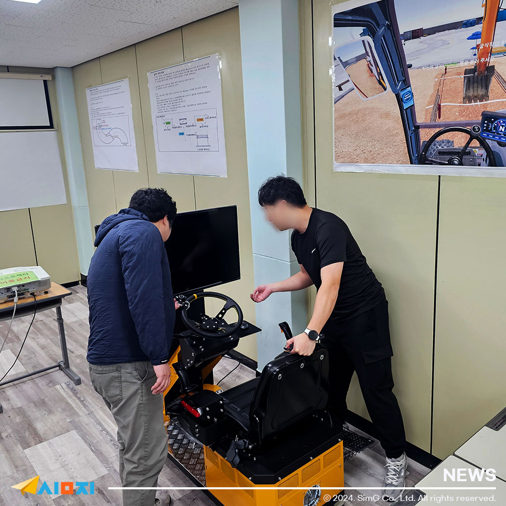 A person explaining how to use the excavator simulator