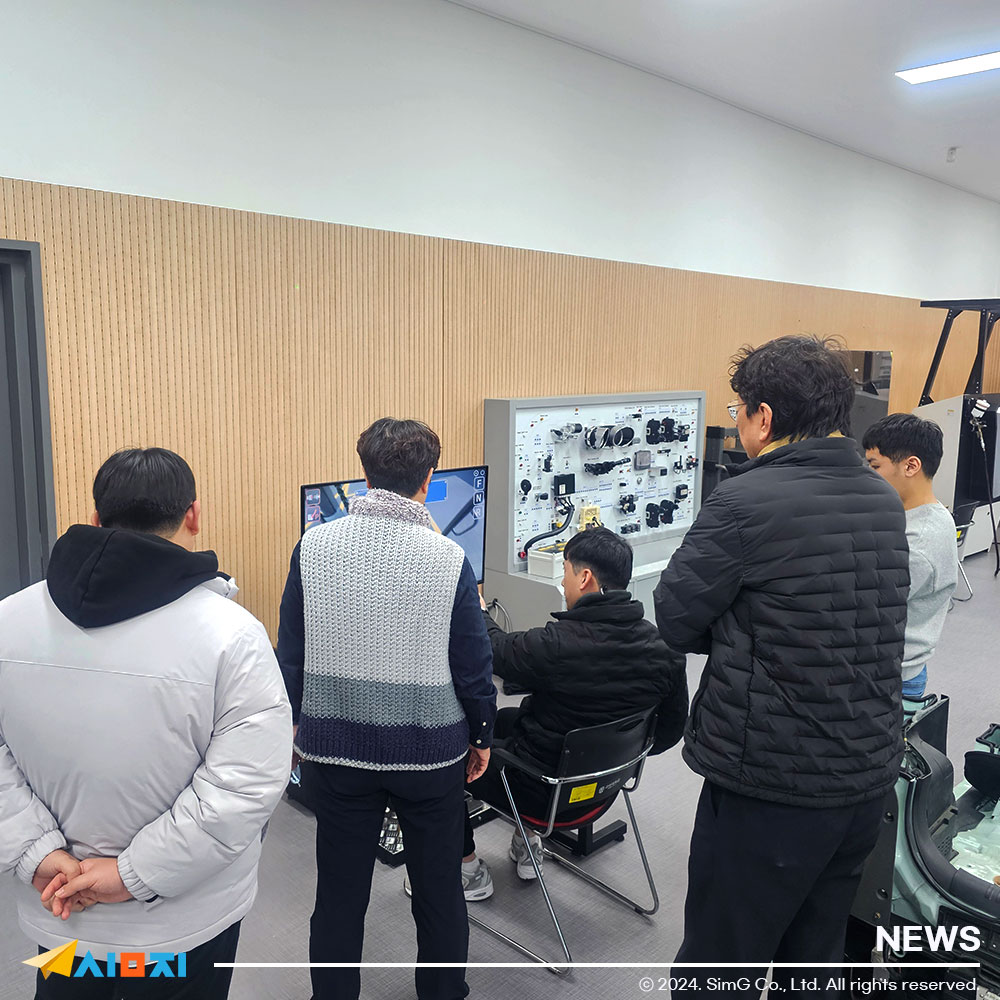 Students using a forklift simulator in training